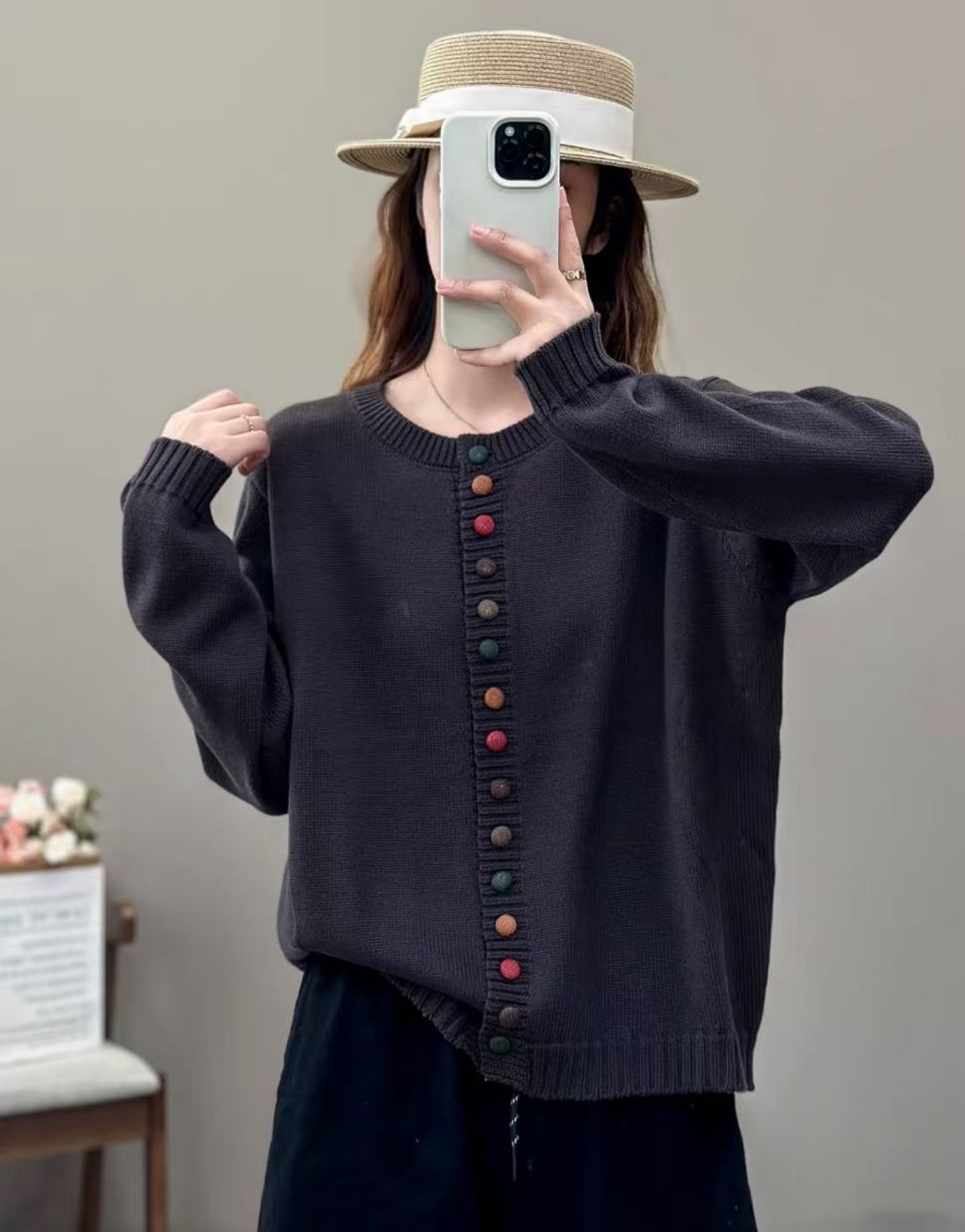 woman wearing a dark sweater with colorful buttons against a plain background.
women’s knit sweater, sleek pullover, casual knit top, lightweight sweater, everyday women’s pullover, soft knit sweater, stylish women’s sweater, versatile knitwear, comfortable pullover, modern women’s sweater

